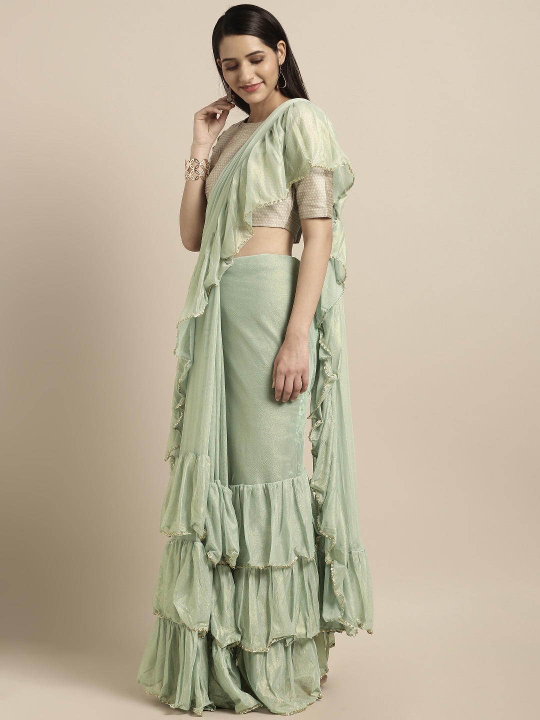 

Triveni Sea Green Solid Net Saree