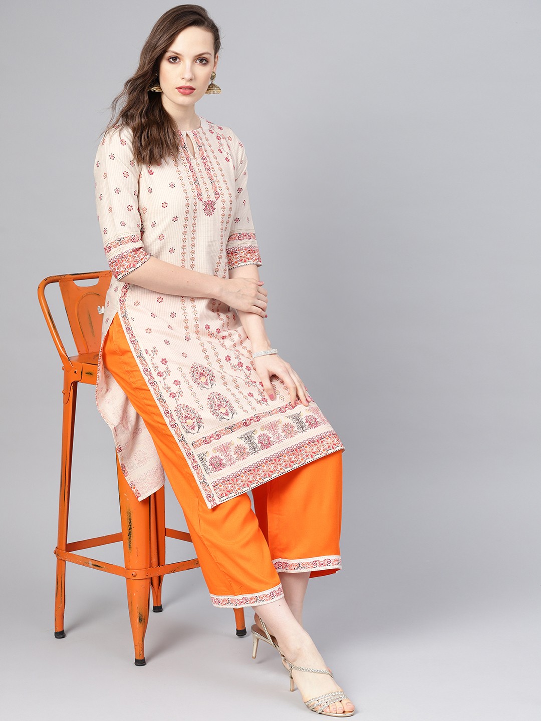 

Libas Women Off-White & Orange Printed Kurta with Palazzos