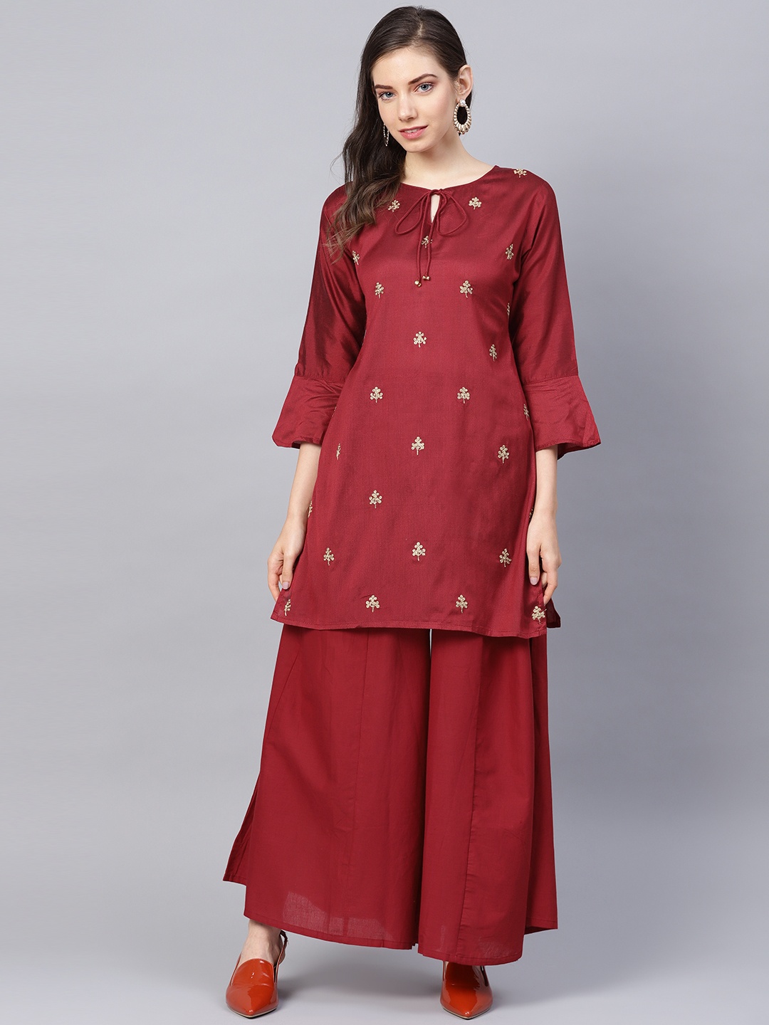 

Bhama Couture Women Rust Red Embroidered Kurta with Palazzos