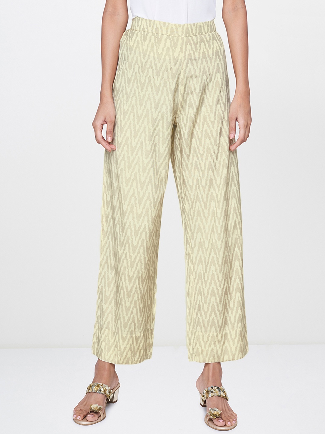 

Global Desi Women Cream-Coloured & Brown Regular Fit Printed Trousers
