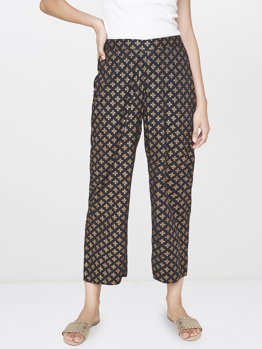 

Global Desi Women Black & Golden Regular Fit Printed Regular Trousers