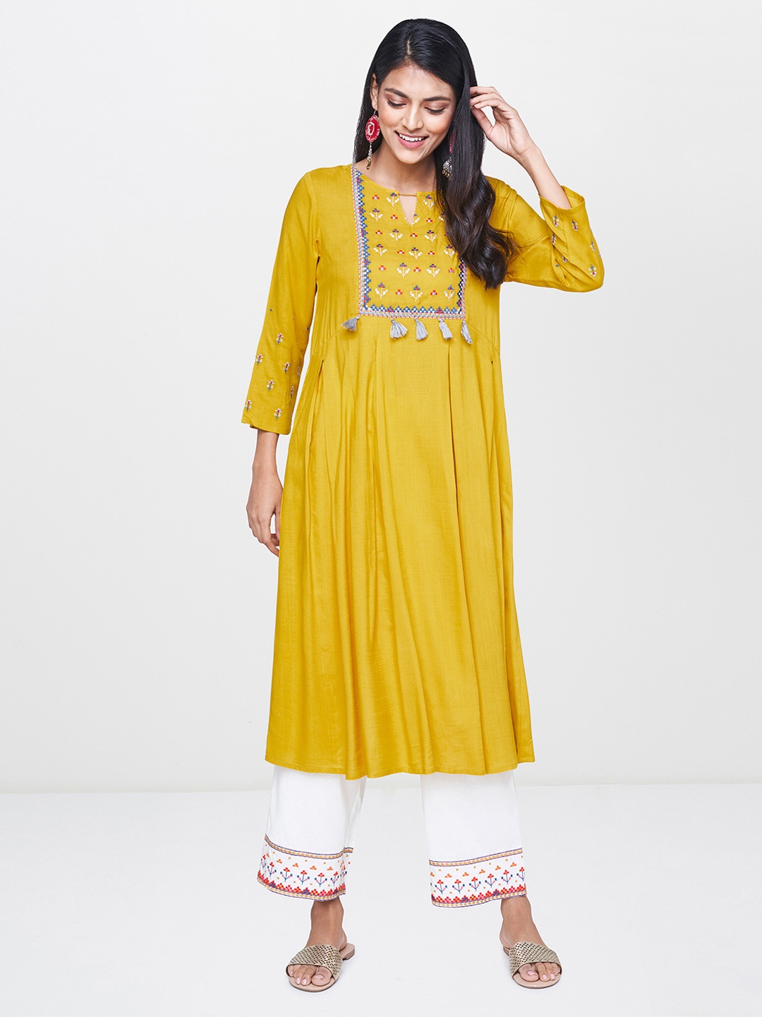 

Global Desi Women Mustard Yellow & Off-White Embroidered Kurta with Palazzos