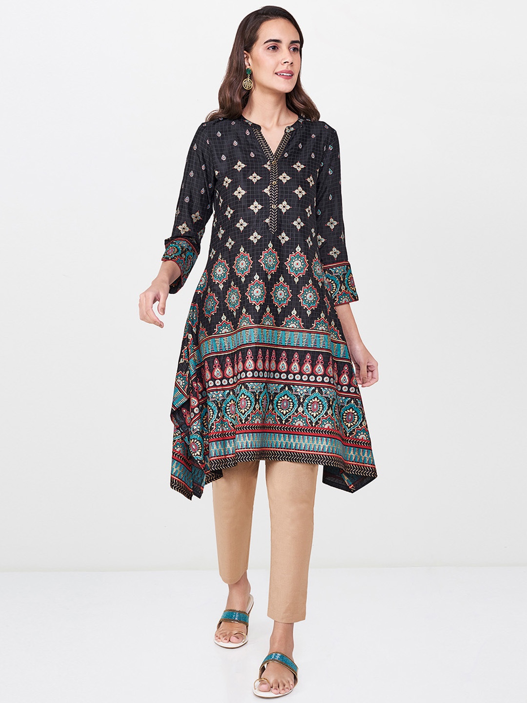 

Global Desi Women Black & Gold-Toned Asymmetric Printed A-Line Kurta