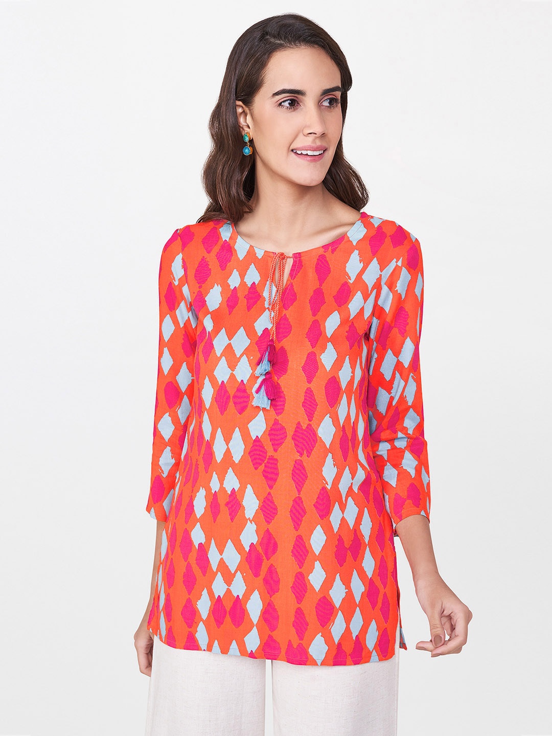 

Global Desi Women Coral Orange & Turquoise Blue Printed Top