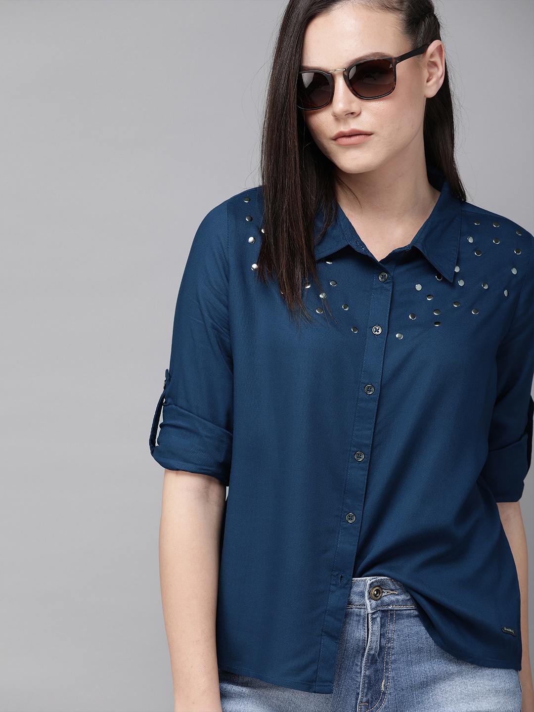 

The Roadster Lifestyle Co Women Teal Blue Regular Fit Solid Casual Shirt with Embellishments