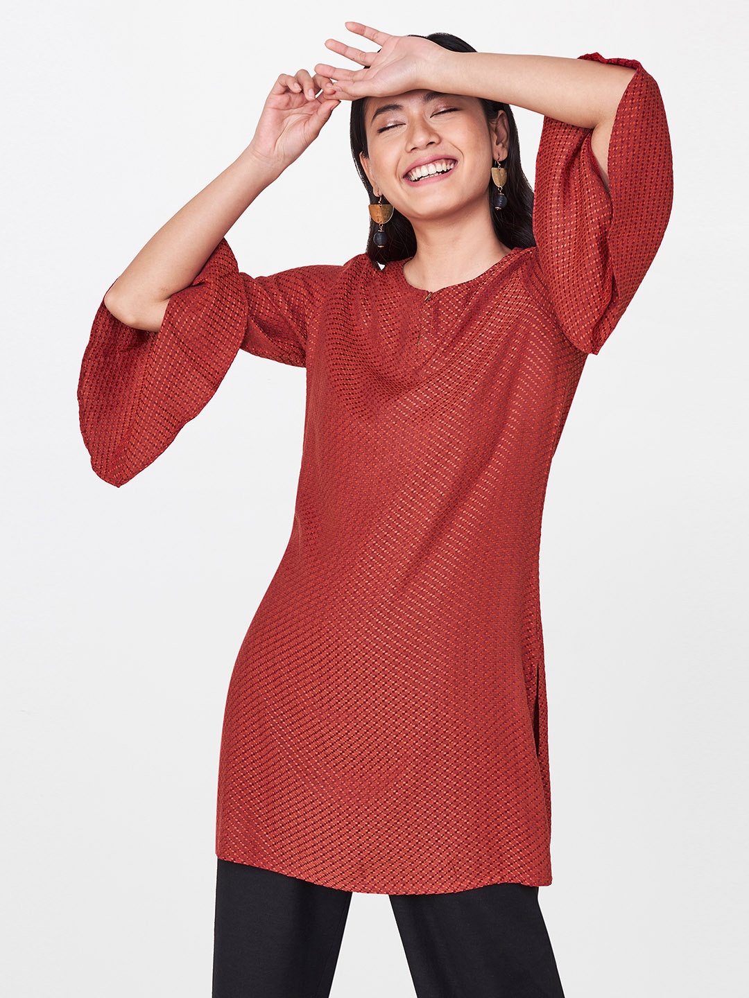

Global Desi Women Maroon Self Design Tunic