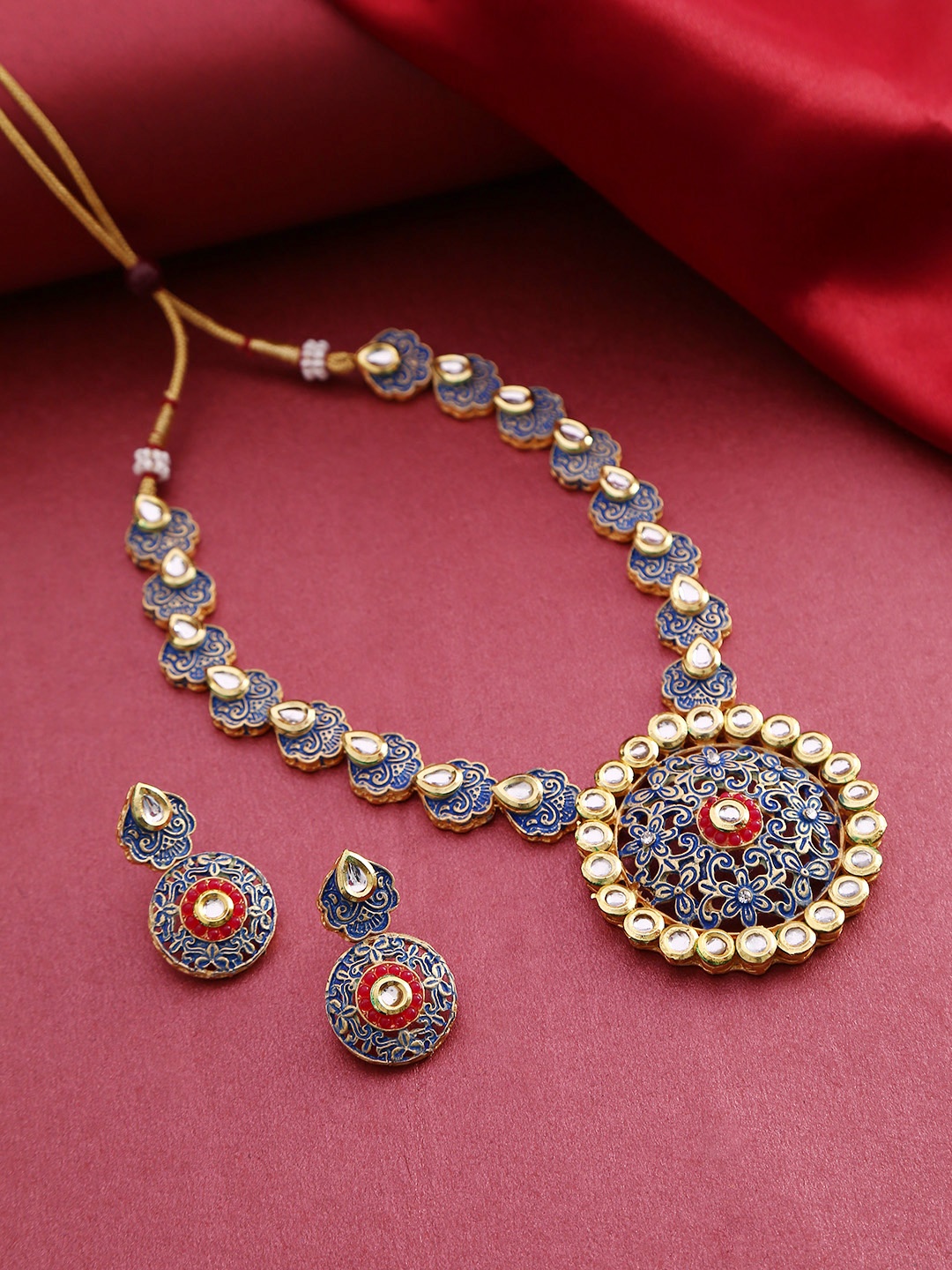 

Priyaasi Blue Gold-Plated Kundan Studded Hand Painted & Textured Jewellery Set