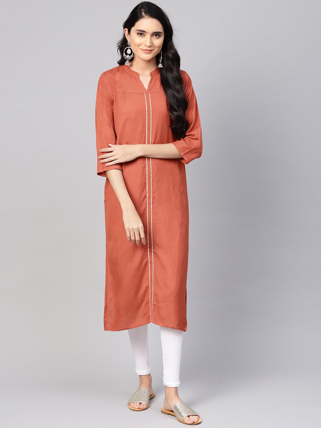 

Varanga Women Rust Orange Solid Straight Kurta