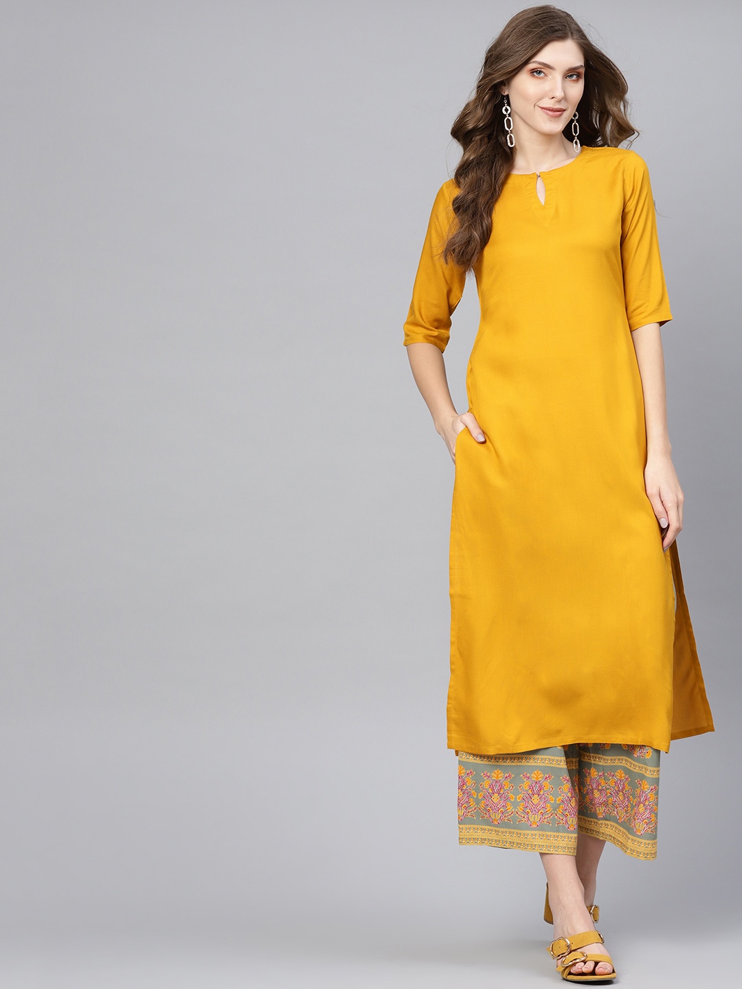 

Libas Women Mustard Yellow & Green Solid Kurta with Palazzos