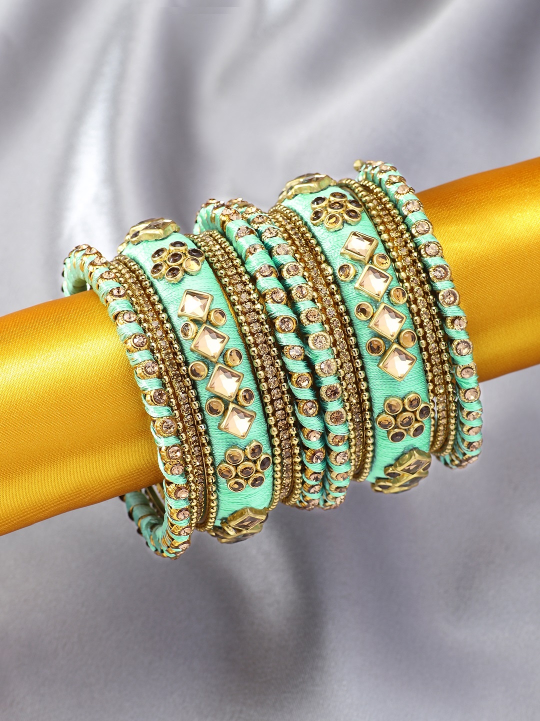 

Peora Set of 18 Gold-Plated & Sea Green Embellished Handmade Silk Thread Chudas