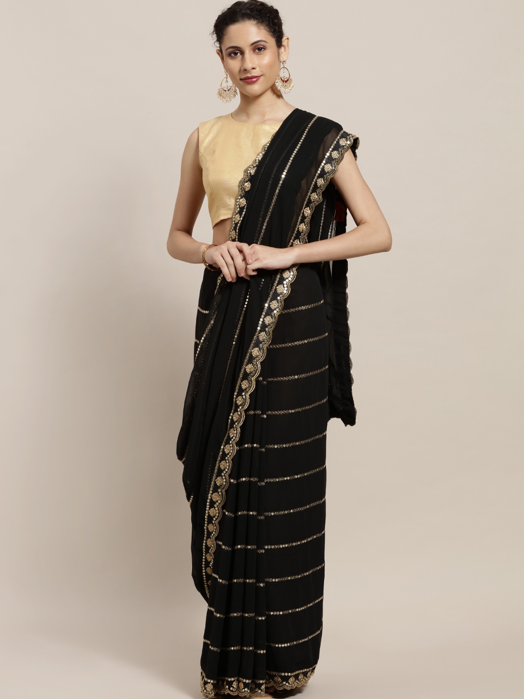 

Sugathari Black & Golden Embroidered Poly Georgette Saree