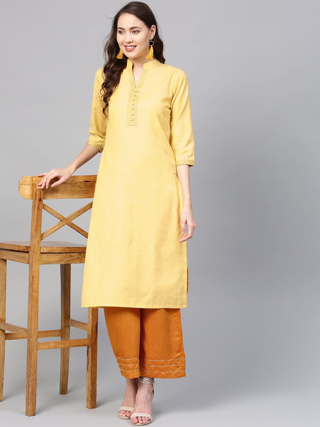 

Indo Era Women Yellow Solid Straight Kurta