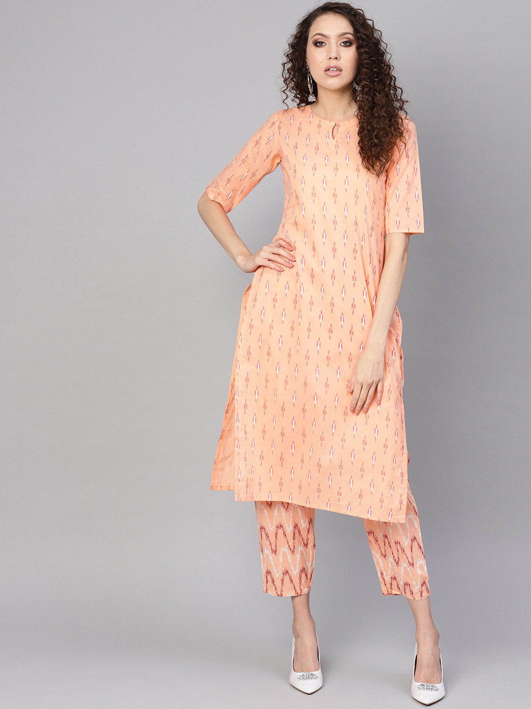 

Gerua By Libas Women Peach-Coloured Red Printed Kurta with Trousers
