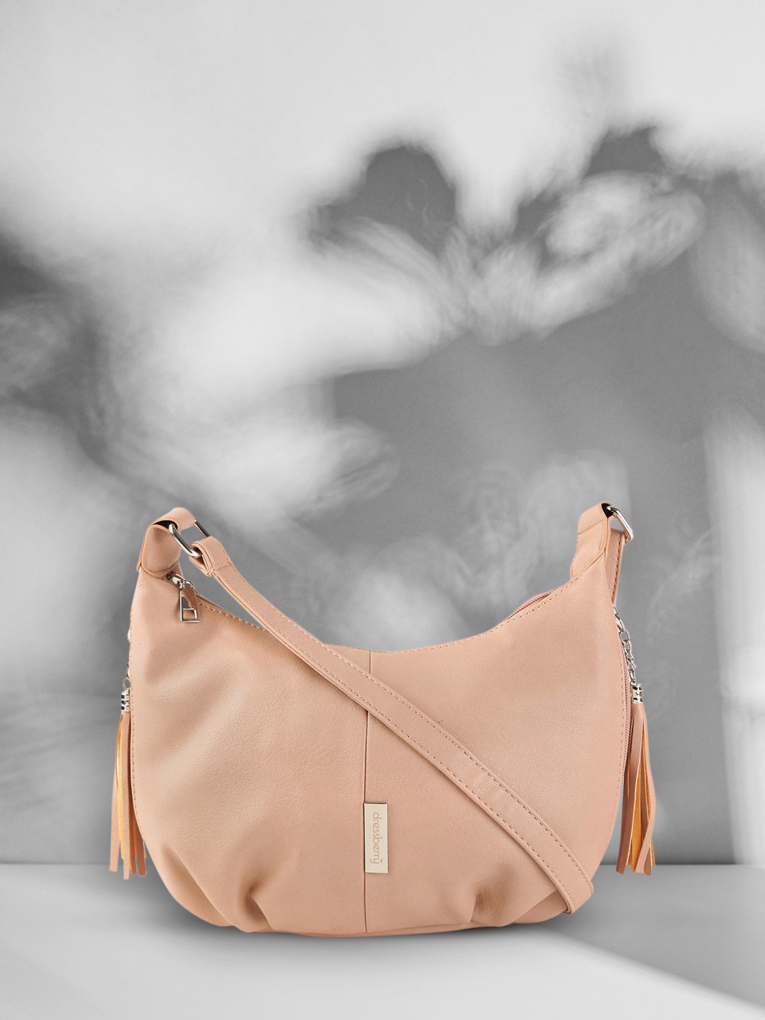 

DressBerry Pink Solid Tasselled Sling Bag