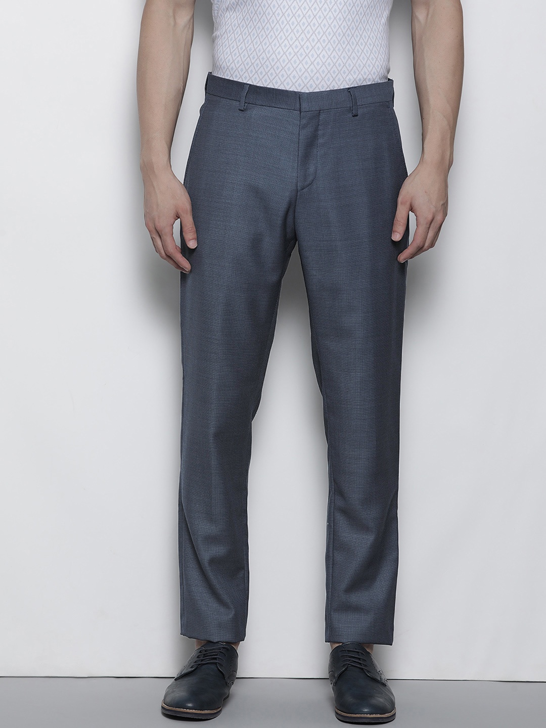 

Tommy Hilfiger Men Navy Blue Self Designed Formal Trousers