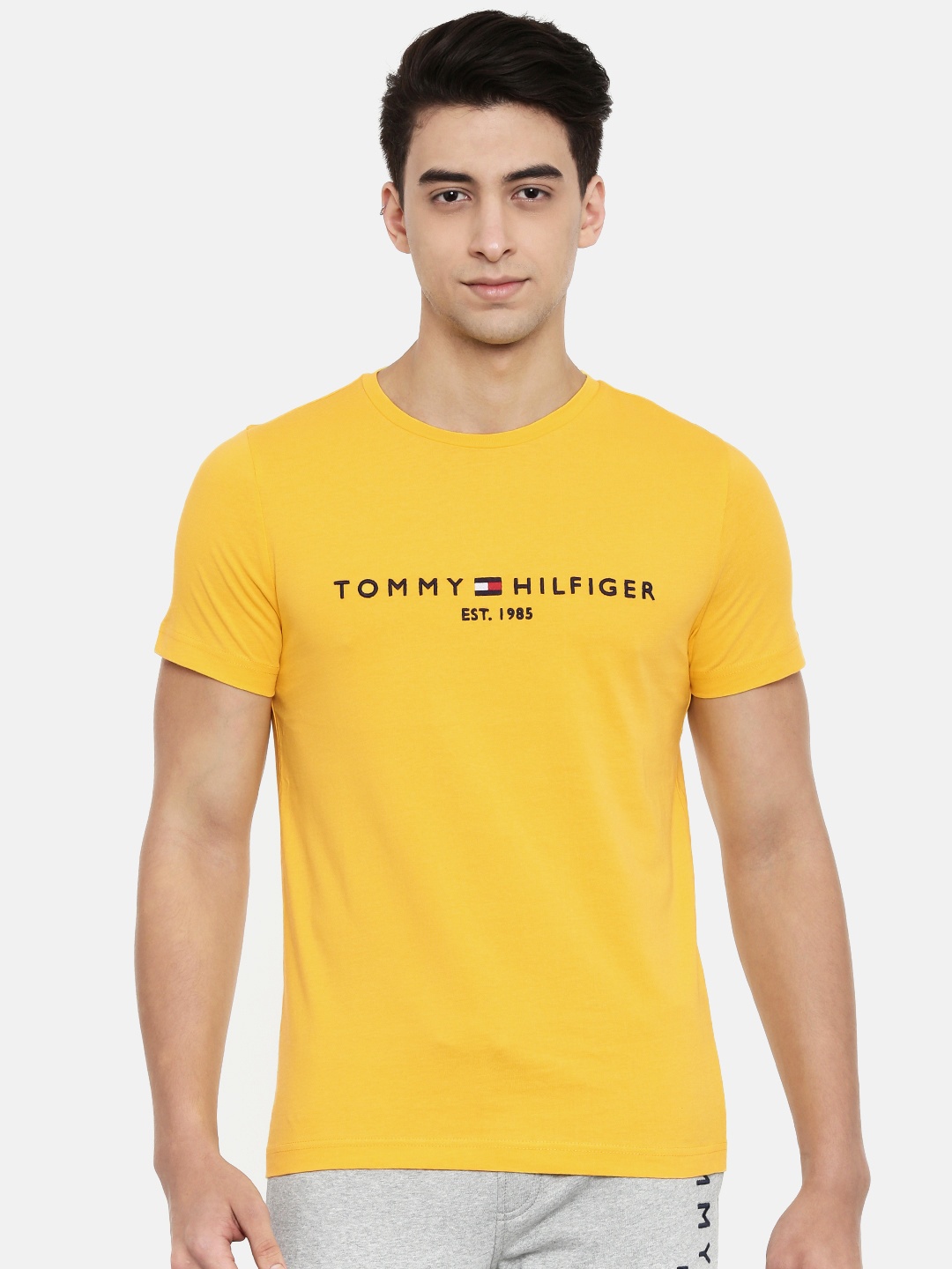 

Tommy Hilfiger Men Yellow Embroidered Solid Round Neck Pure Cotton T-shirt