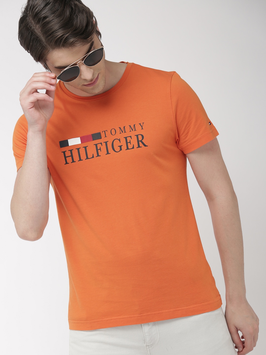 

Tommy Hilfiger Men Orange Printed Round Neck Pure Cotton T-shirt