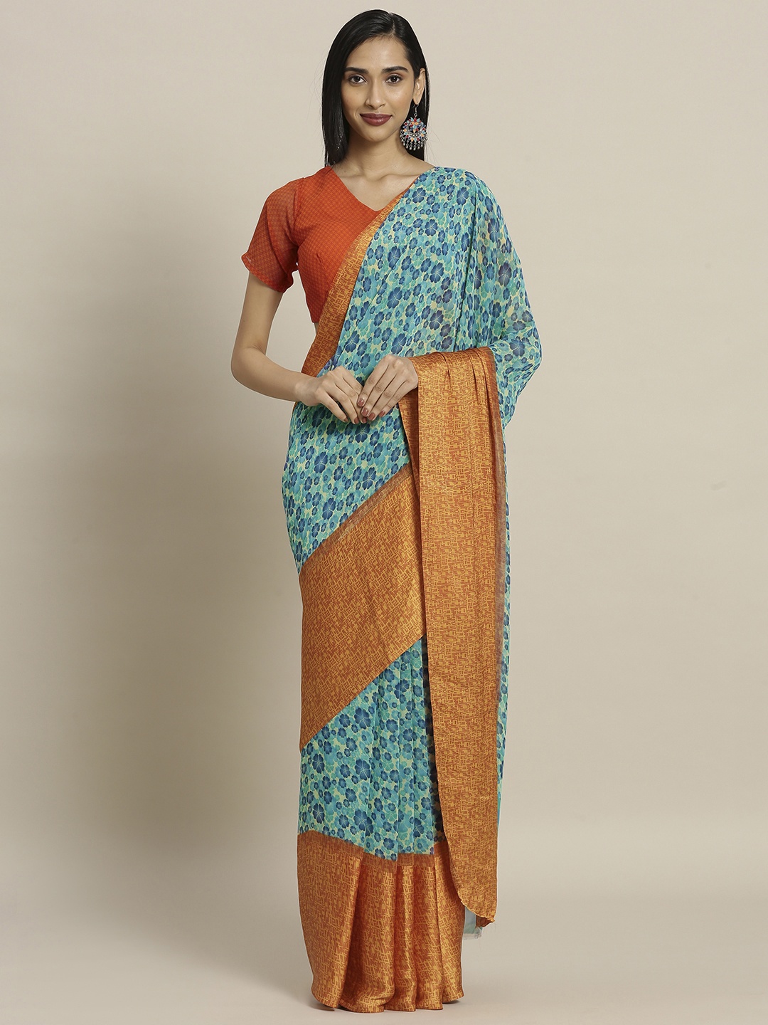 

Shaily Turquoise Blue & Orange Satin Printed Saree