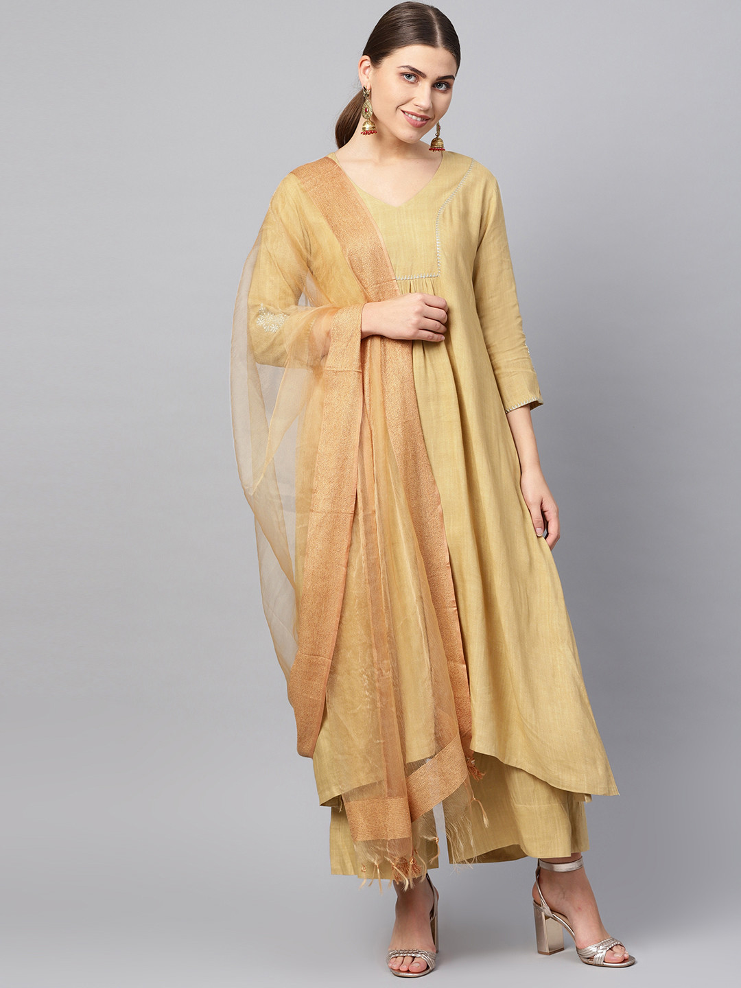 

Varanga Women Beige Solid Kurta with Palazzos