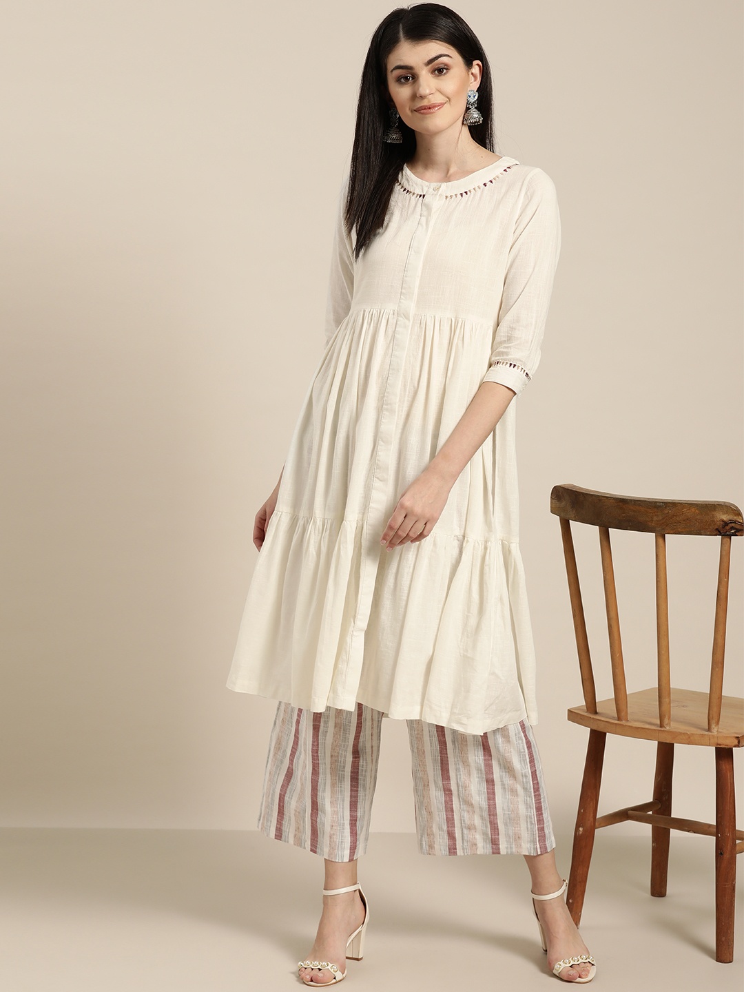 

Sangria Women Off-White Solid Kurta with Palazzos