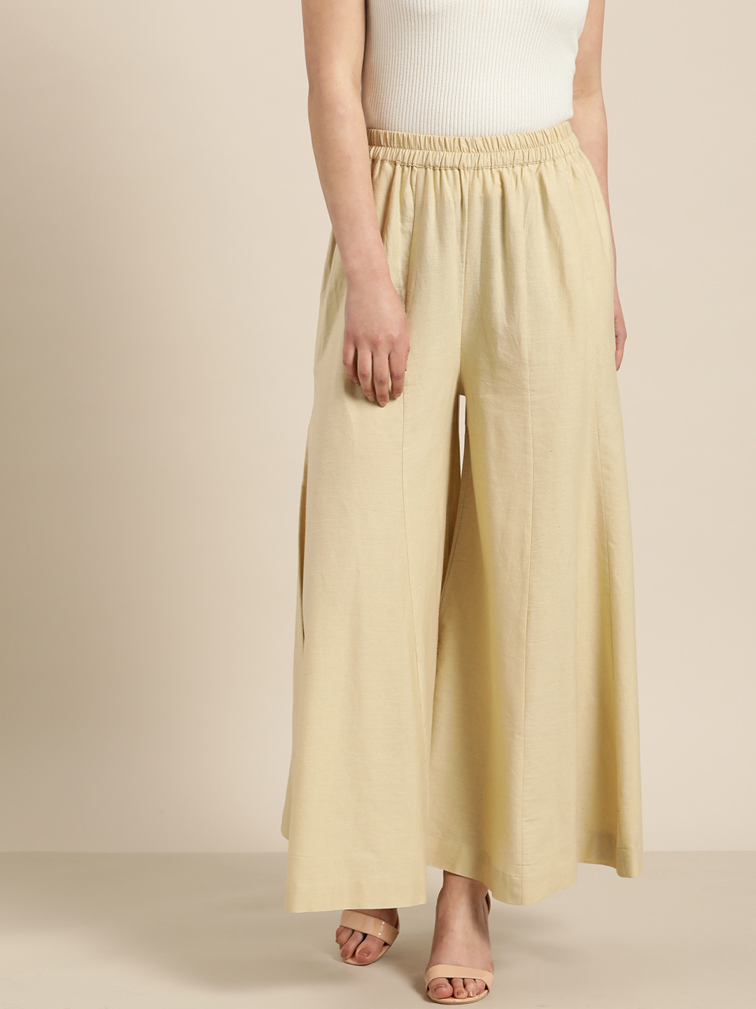 

Sangria Women Beige Solid Flared Palazzos
