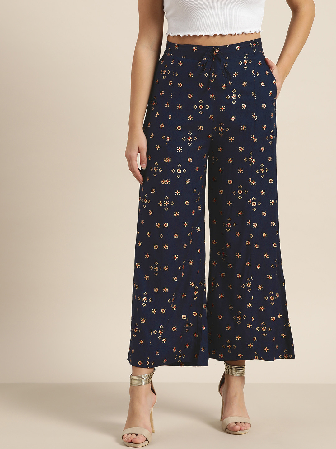 

Sangria Women Navy Blue & Golden Printed Wide Leg Palazzos