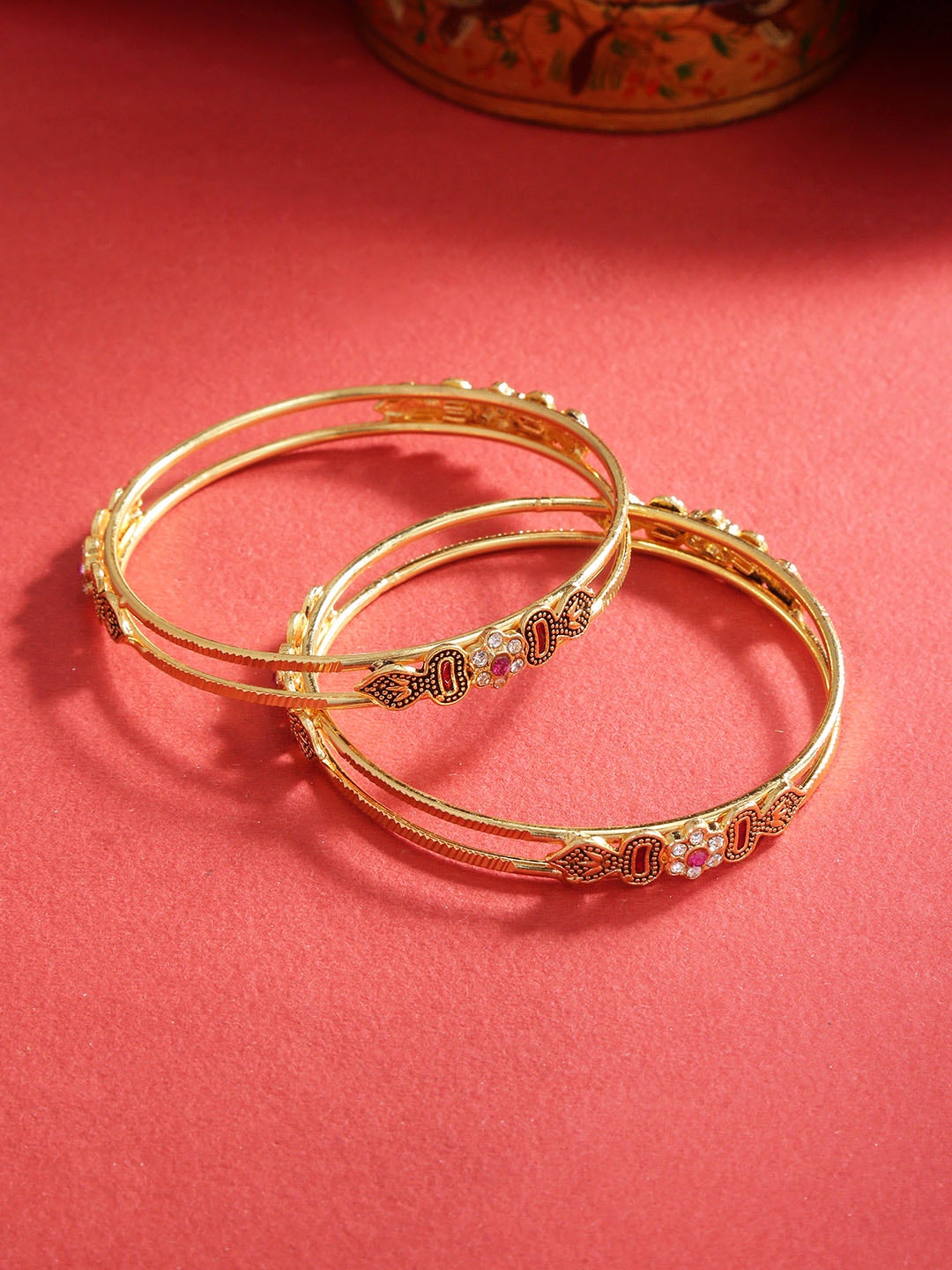 

Priyaasi Set of 2 Pink Gold-Plated Stone-Studded Enamelled Textured Bangles