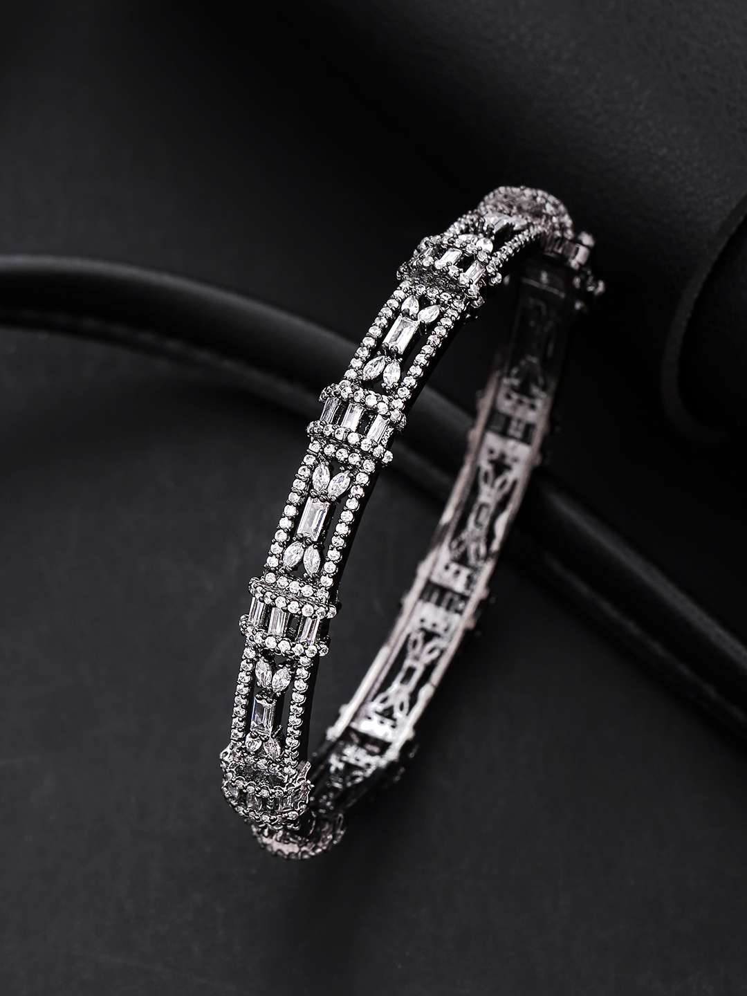 

Priyaasi Gunmetal-Toned Silver-Plated AD-Studded Bangle Style Bracelet, Metallic