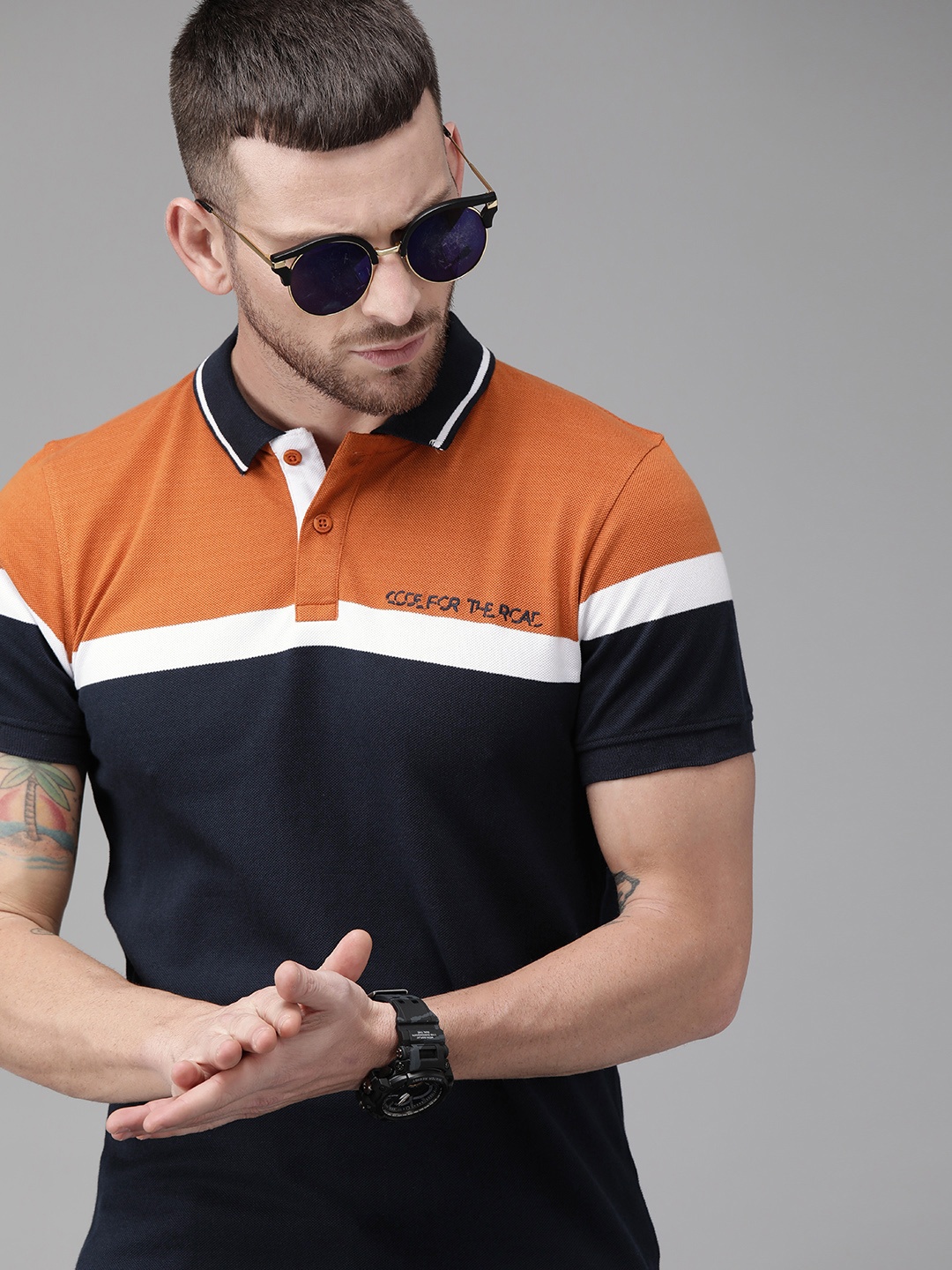 

The Roadster Lifestyle Co Men Navy Blue Rust Orange Colourblocked Polo Collar Pure Cotton T-shirt