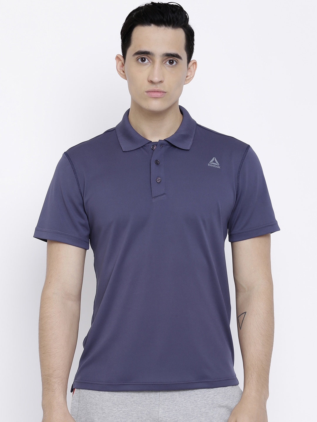 

Reebok Men Navy Solid Pique Polo Collar T-shirt, Navy blue