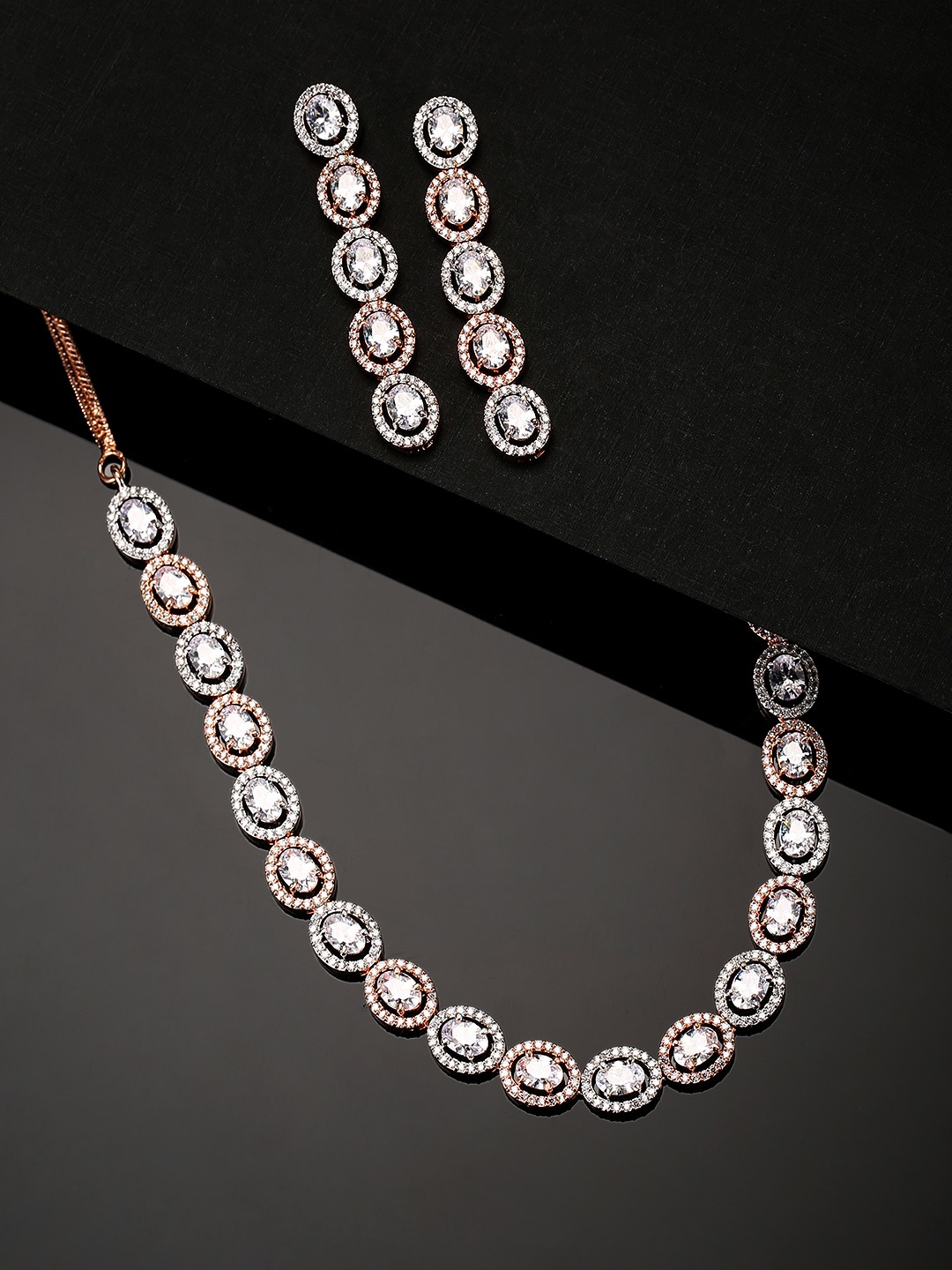 

Priyaasi Silver-Toned Rose Gold-Plated American Diamond Studded Handcrafted Jewellery Set