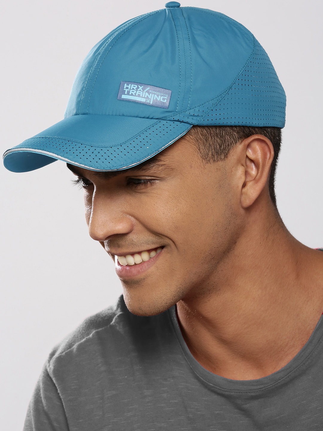 

HRX by Hrithik Roshan Men Teal Blue Solid Training Dry Fit with Sweatband Cap