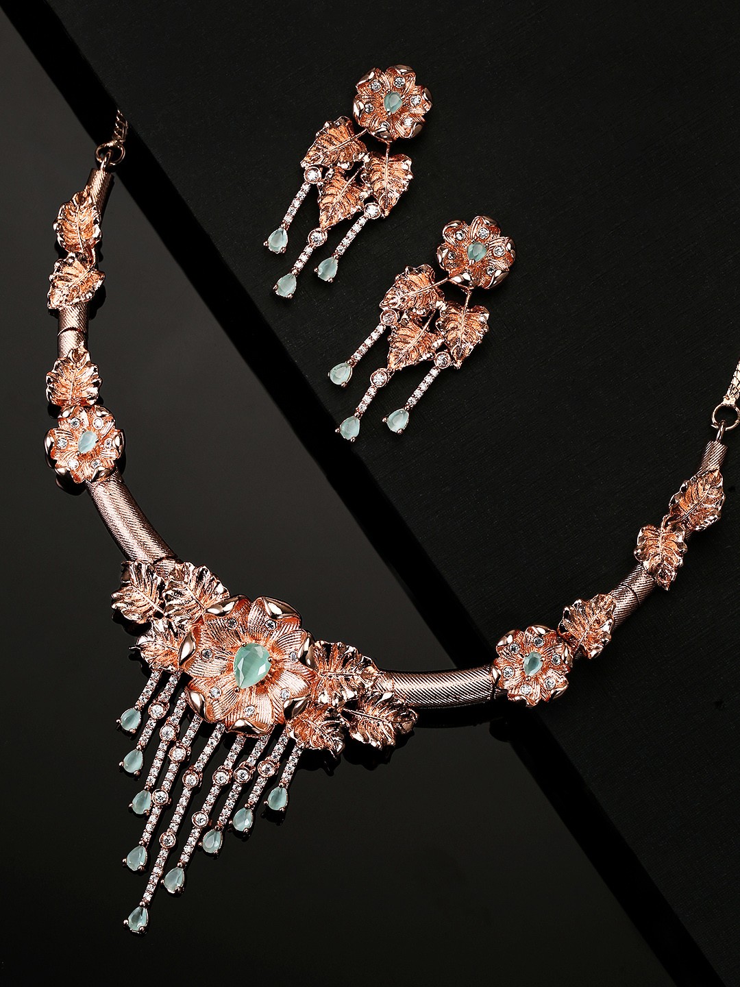

Priyaasi Mint Green Rose Gold-Plated Stone-Studded Handcrafted Floral Shaped Jewellery Set