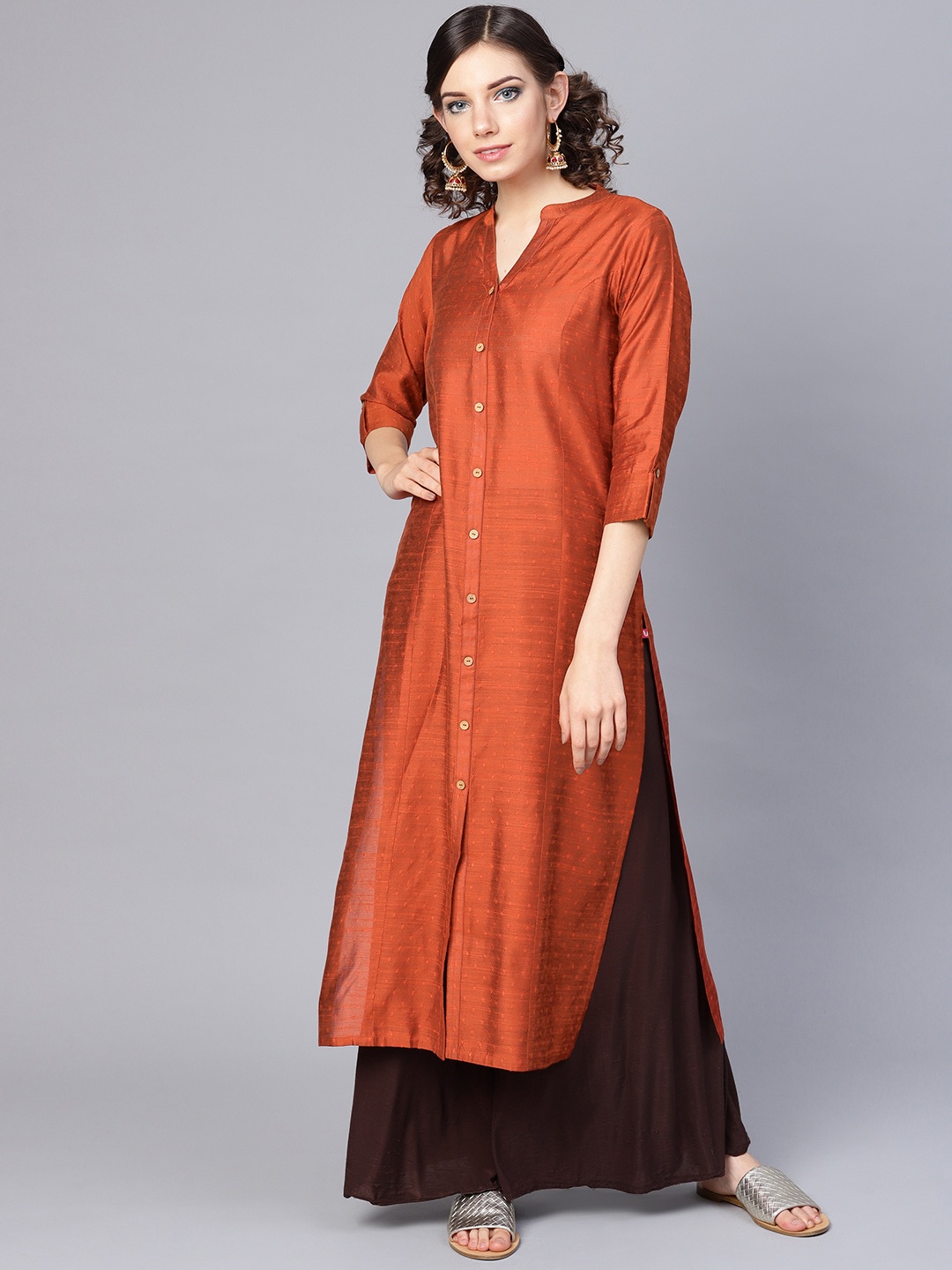 

Varanga Women Rust Orange Dobby Weave Woven Design Straight Kurta