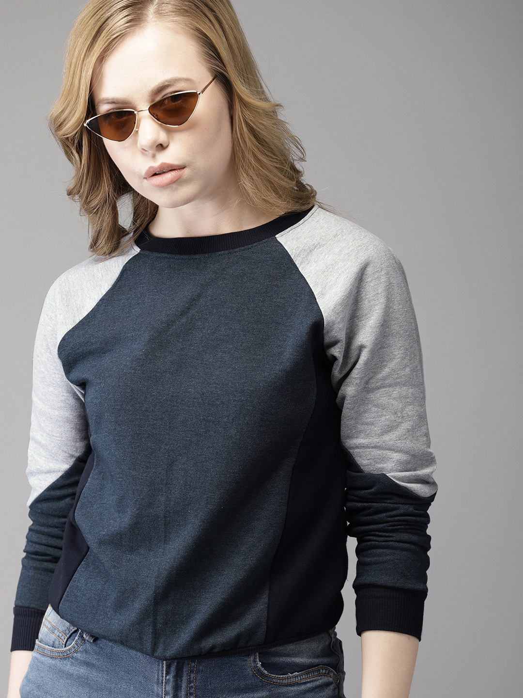 

Campus Sutra Women Navy Blue Solid Hooded Sweatshirt