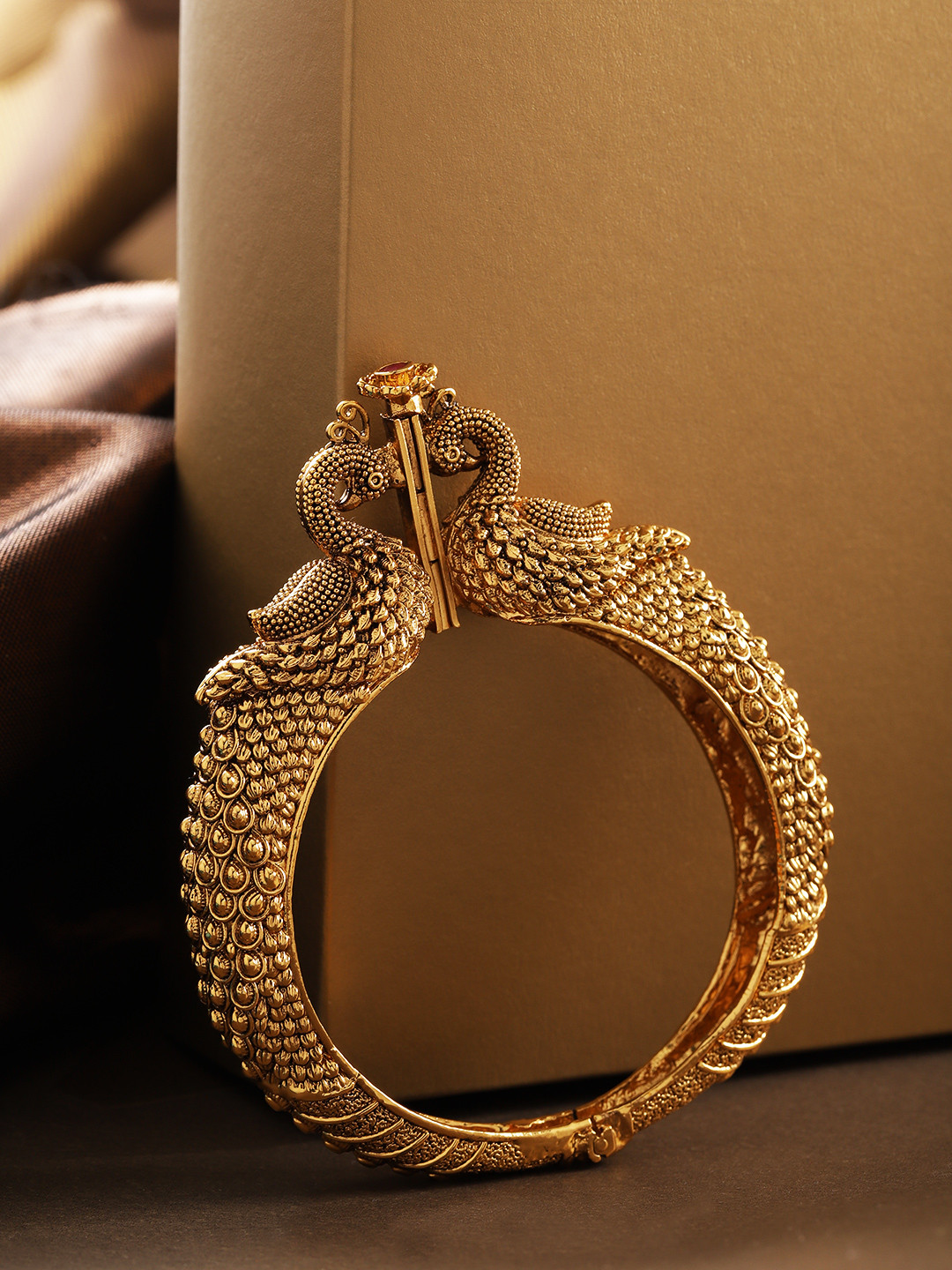 

Priyaasi Gold-Plated Stone Studded Peacock Shaped Handcrafted Bangle