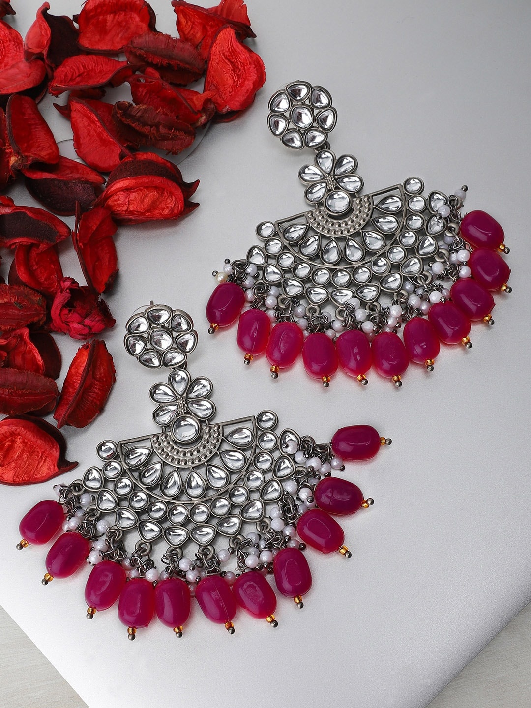 

Rubans Silver-Toned & Pink Crescent Shaped Handcrafted Kundan Studded Drop Earrings