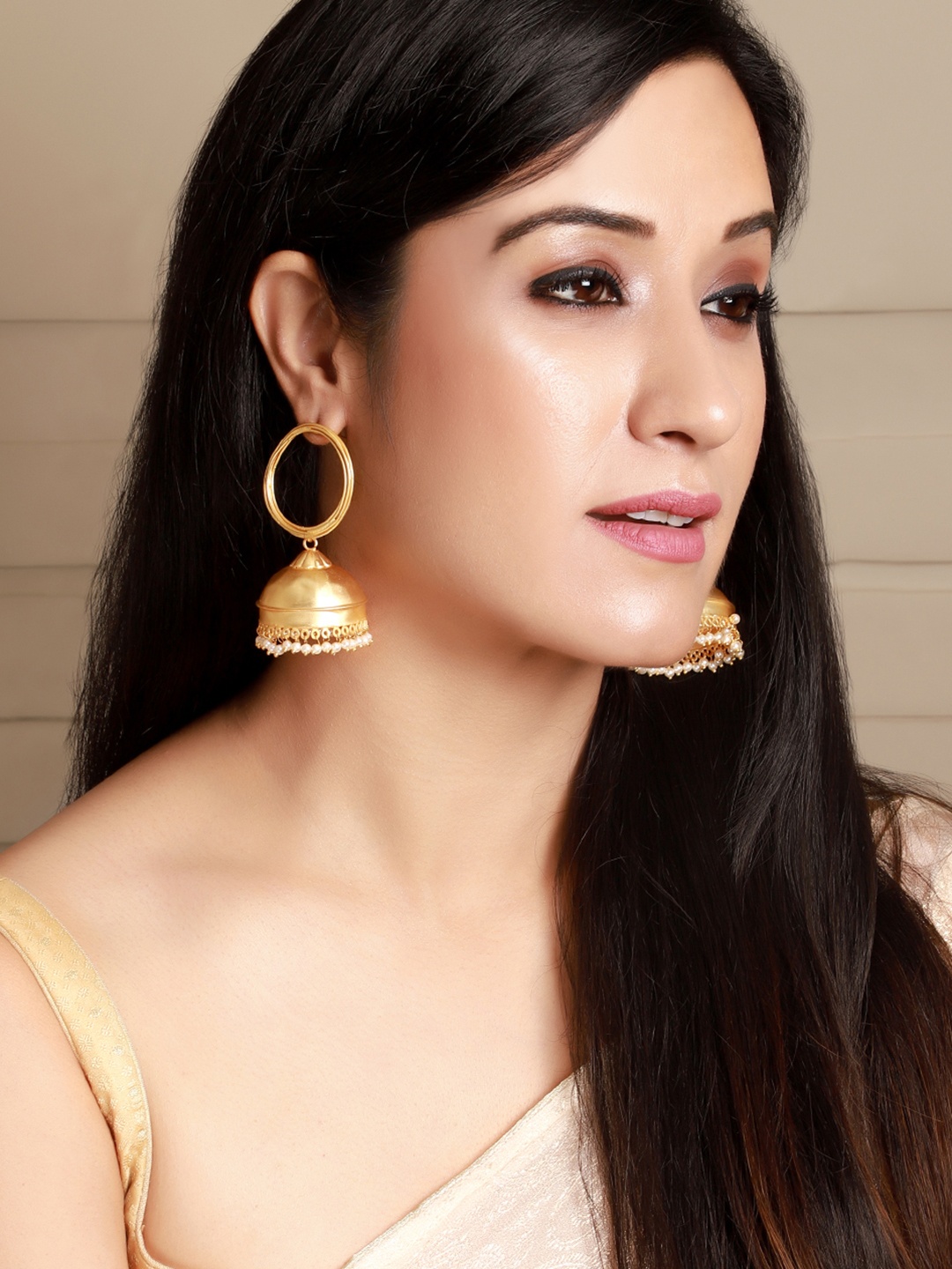

Rubans Gold-Toned & White Dome Shaped Handcrafted Elegant Pearl Embellished Jhumkas