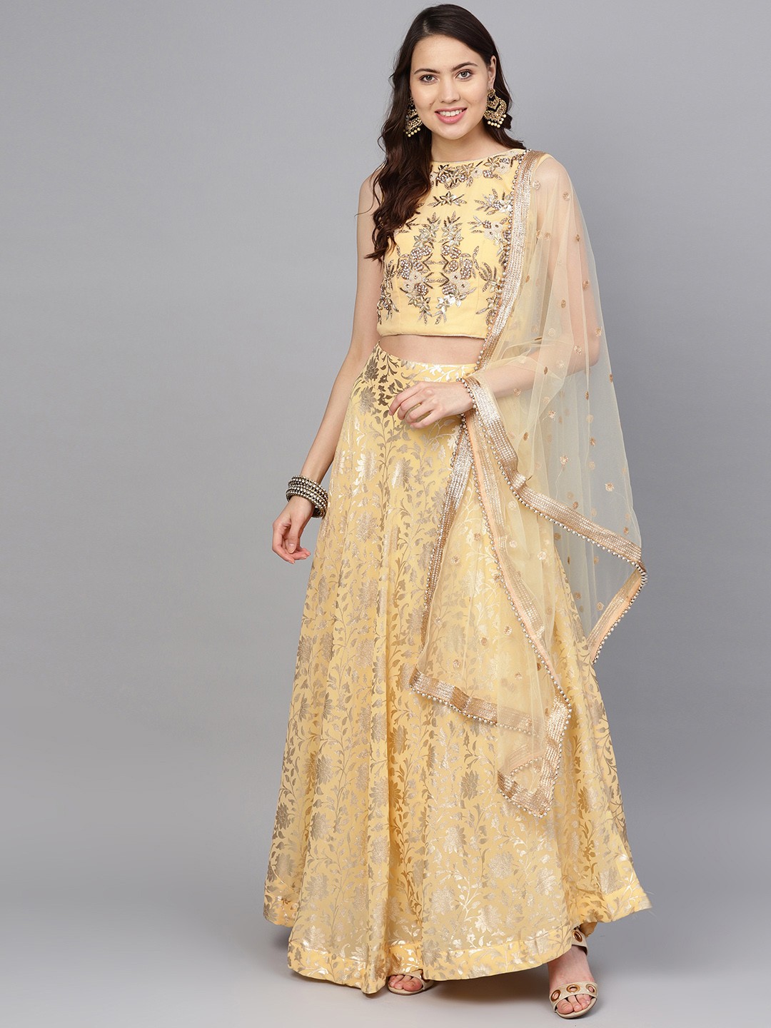

Chhabra 555 Women Yellow & Golden Made to Measure Foil Print Lehenga & Choli with Dupatta