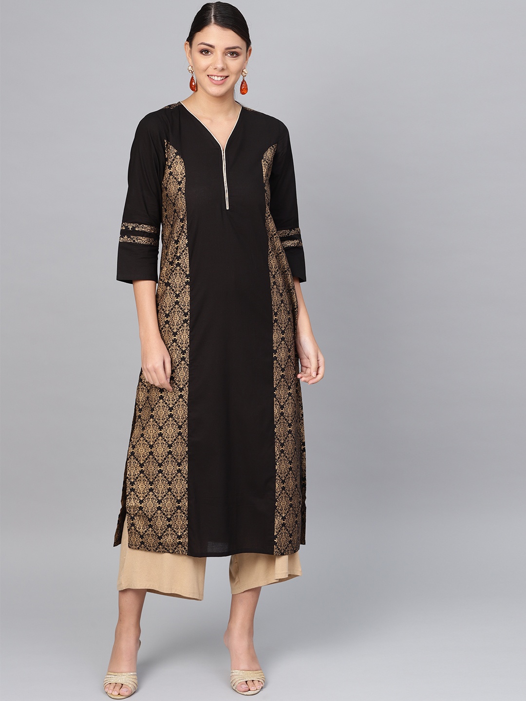 

Meeranshi Women Black & Golden Printed Straight Kurta