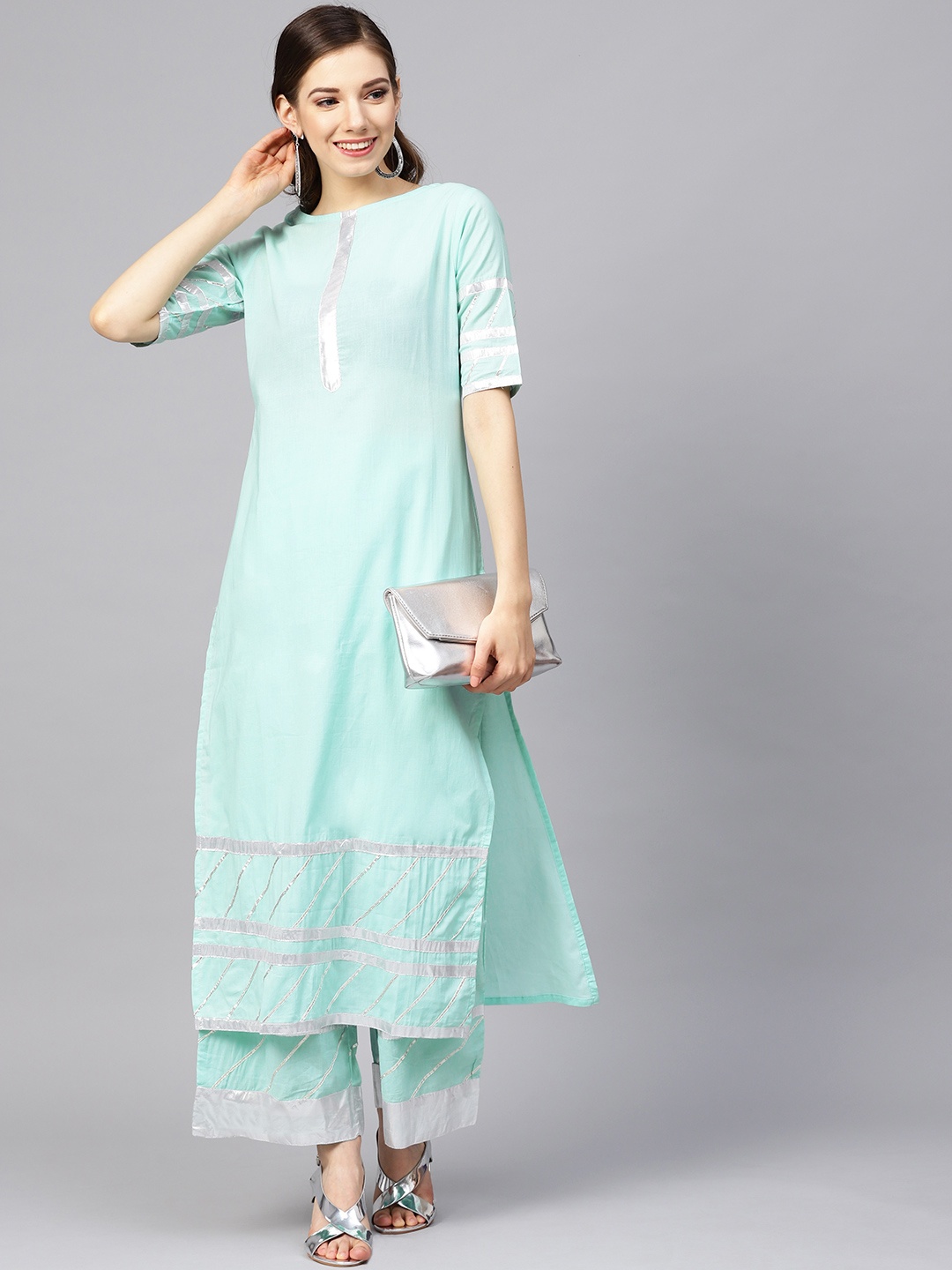 

Meeranshi Women Blue Solid Kurta with Palazzos
