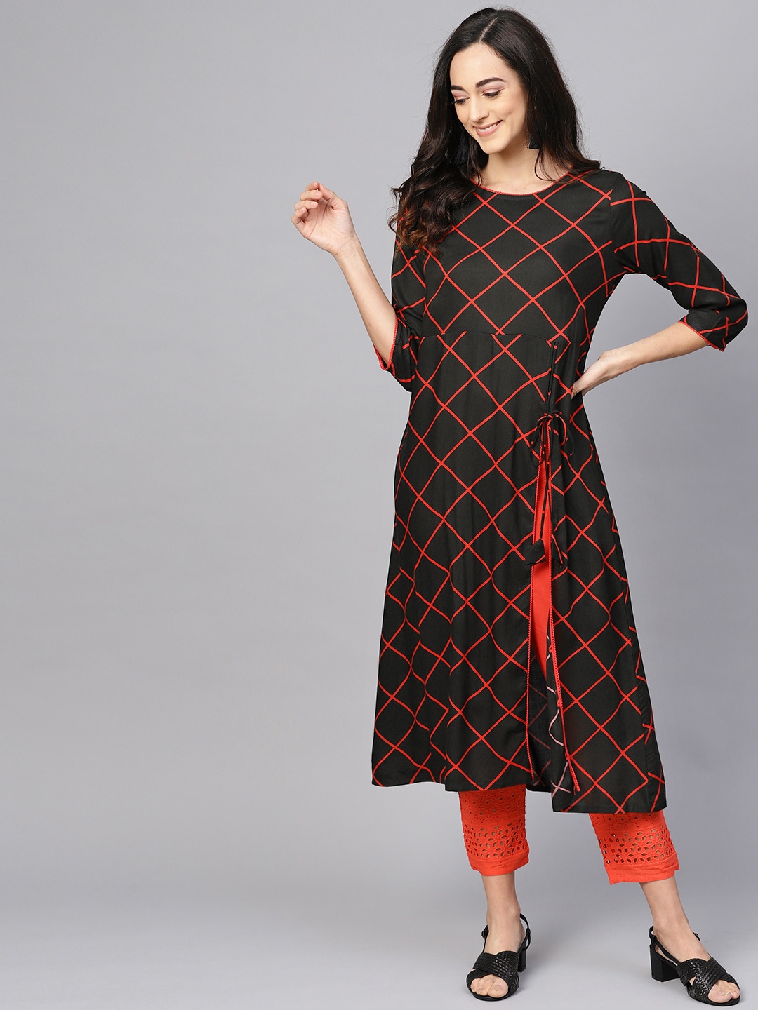 

Meeranshi Women Black & Orange Checked High Slit Kurta with Trousers