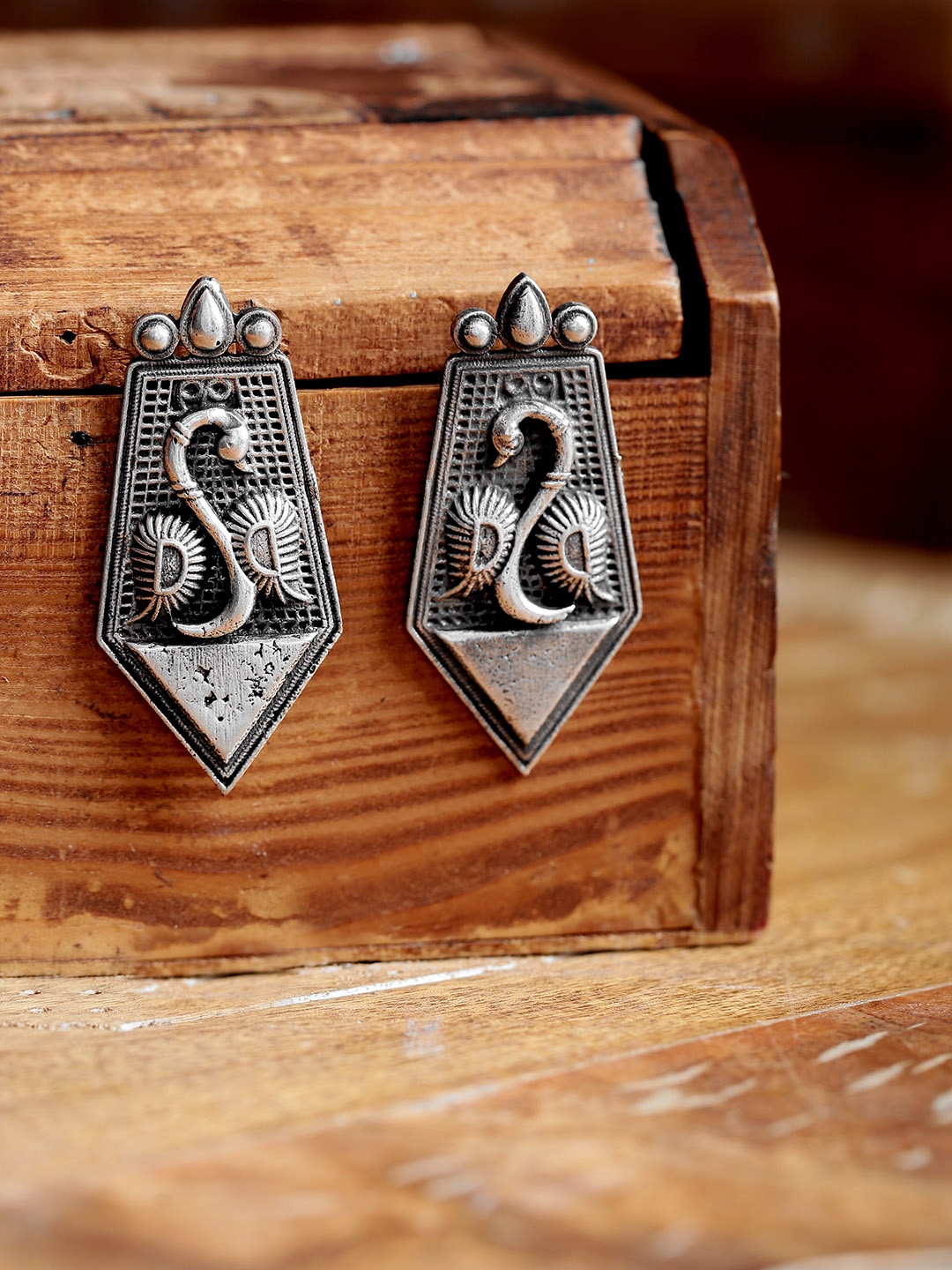 

Infuzze Oxidised Silver-Plated Textured Peacock Shaped Drop Earrings