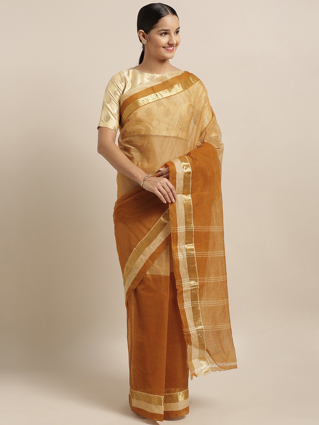 

Mitera Brown Pure Cotton Solid Taant Saree