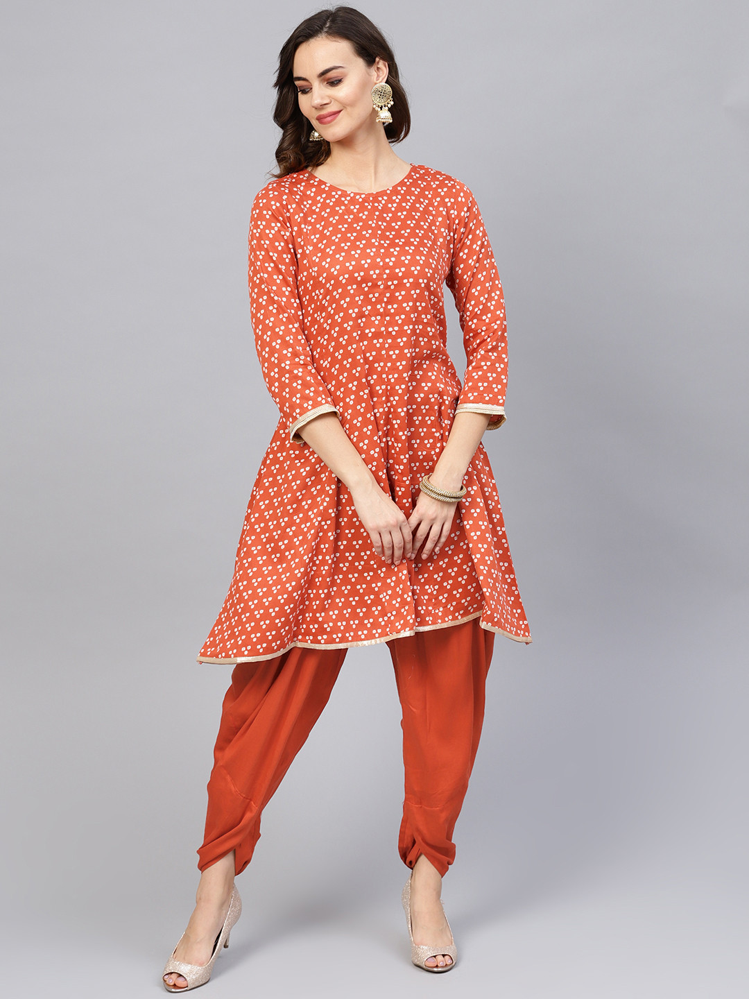

Indo Era Women Rust Orange & Off-White Bandhani Print Kurta with Dhoti Pants