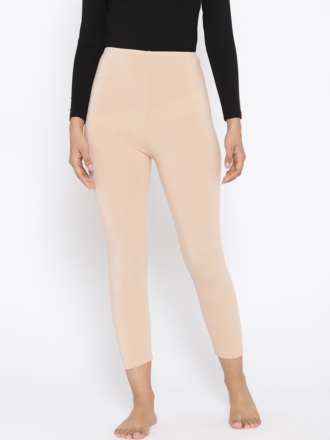 

Kanvin Women Beige Solid Thermal Leggings