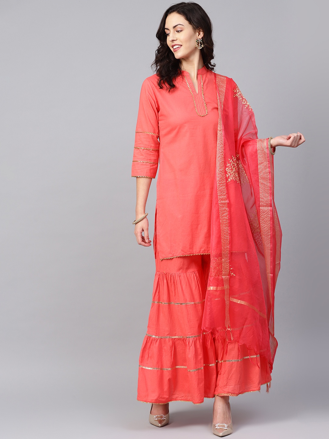 

Bhama Couture Women Peach-Coloured Solid Kurta with Sharara & Dupatta