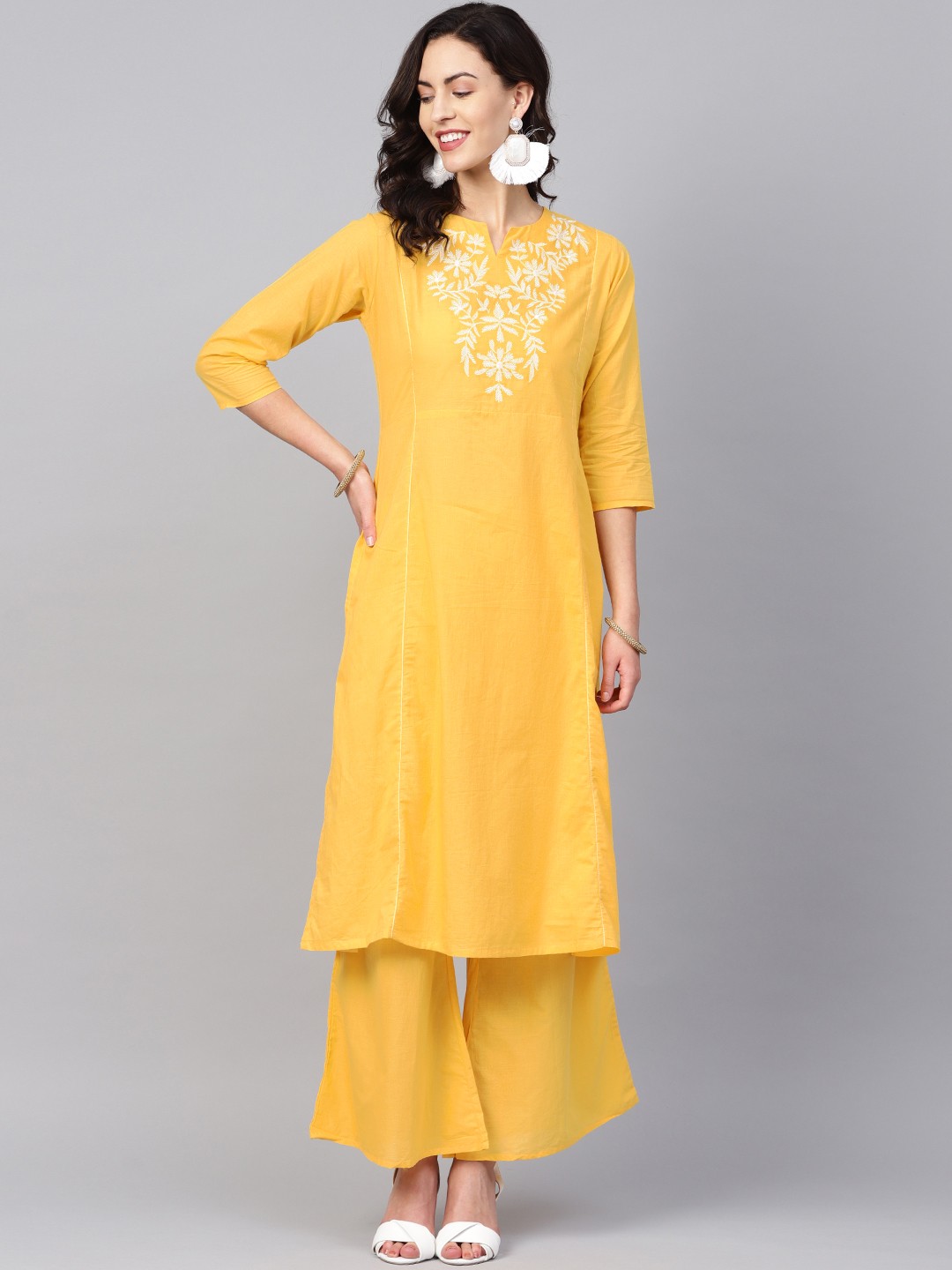 

Bhama Couture Women Yellow Yoke Design Kurta with Palazzos
