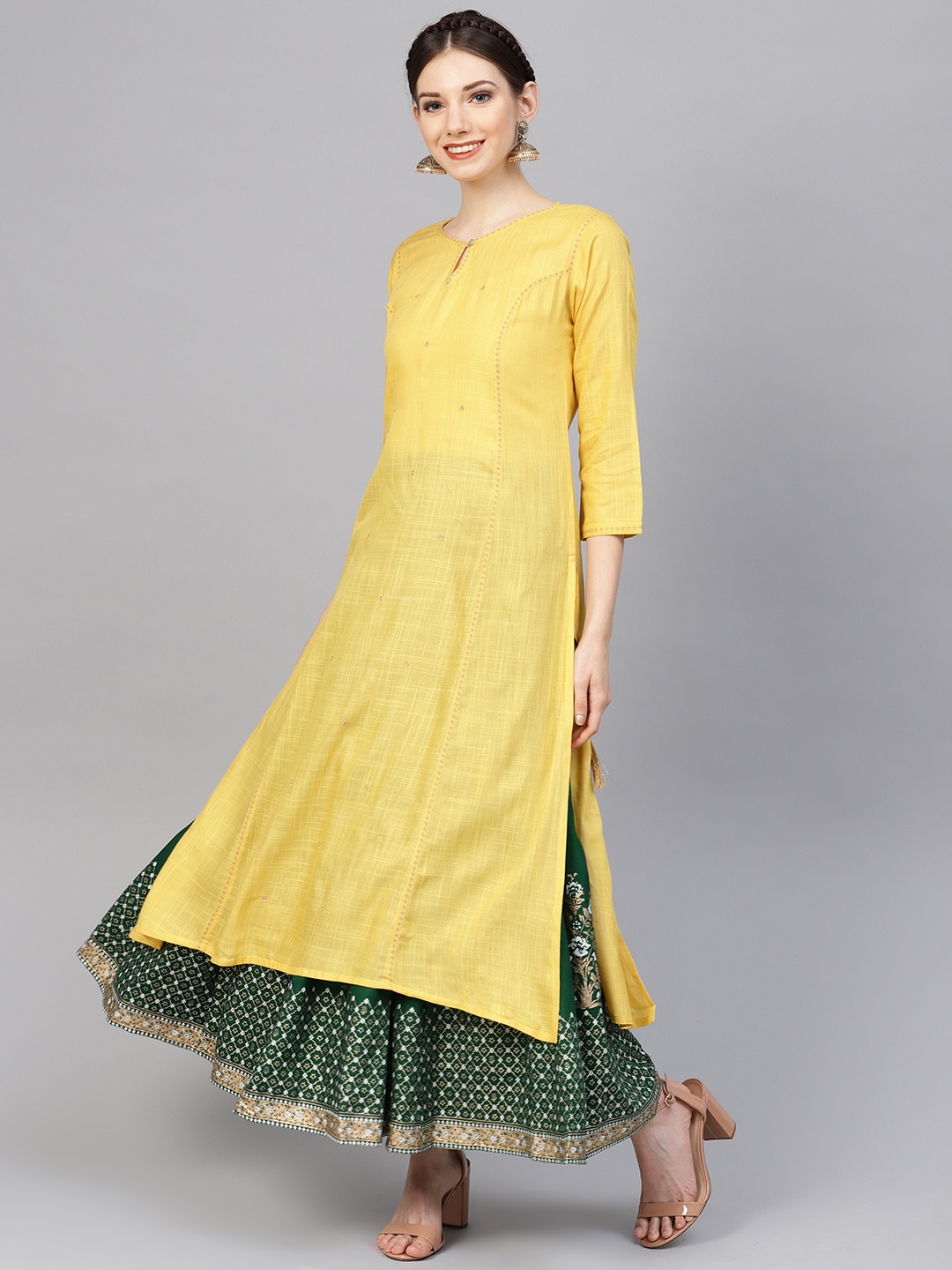 

Varanga Women Yellow & Green Solid Kurta with Skirt