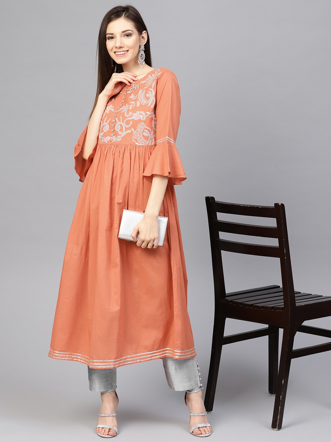 

Varanga Women Orange & Grey Solid Kurta with Trousers